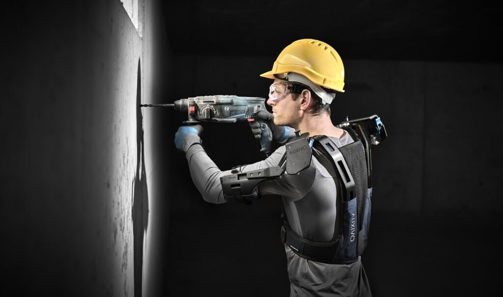 Worker wearing the DeltaSuit industrial exoskeleton