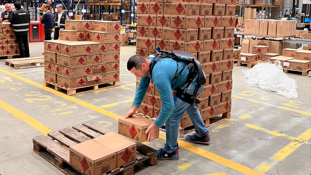 MOVI powered industrial back-support exoskeleton in warehouse use