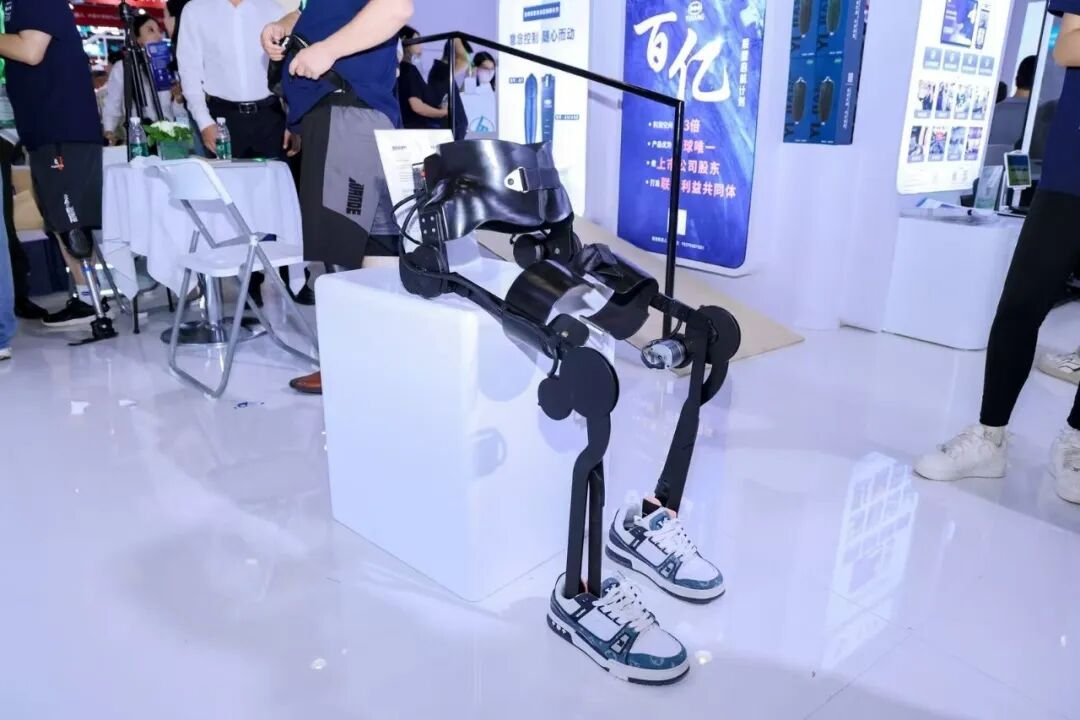 Low-profile walking-assistance exoskeleton being demonstrated in a Chinese rehabilitation technology setting